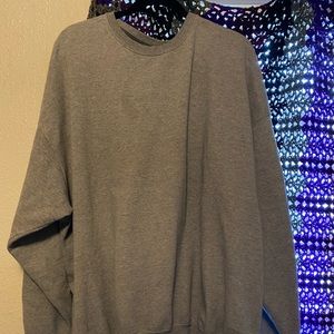 A gray crew neck sweater